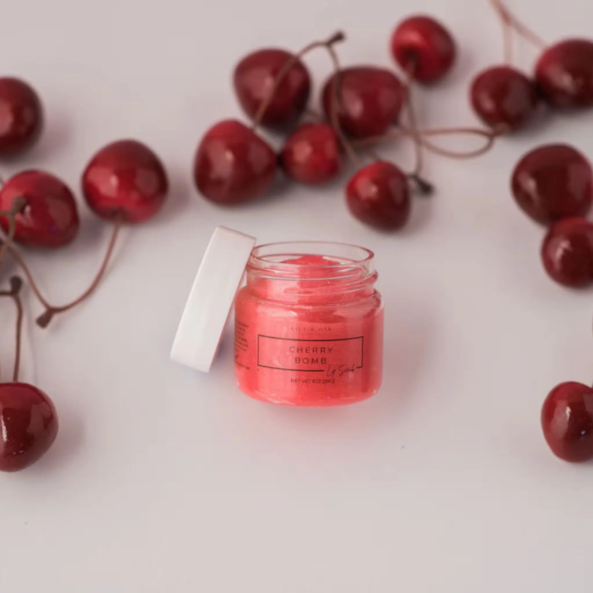 Natural exfoliating lip scrub applied to lips for soft, smooth texture.