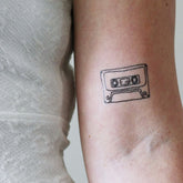 Vintage cassette tape design skin-safe temporary tattoo sheet with 90s music theme on pink background
