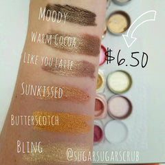 Side view of gingerbread brown shimmer eye shadow in sifter jar showing mineral texture and warm cocoa tones