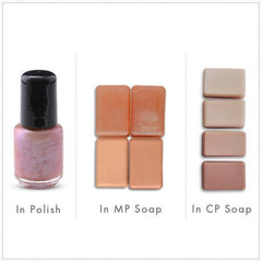 Nail polish bottle with black cap and pink pearlescent color, soap bars in various colors