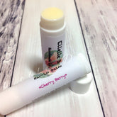 Lip balm tubes with white and pink text, yellow balm, and Har,Lo brand name visible