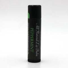 Lip balm tube with black body, green label, and white text for peppermint flavor