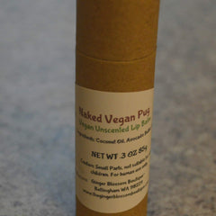 Vegan lip balm in brown cardboard tube with printed label, Naked Vegan Pug brand name visible