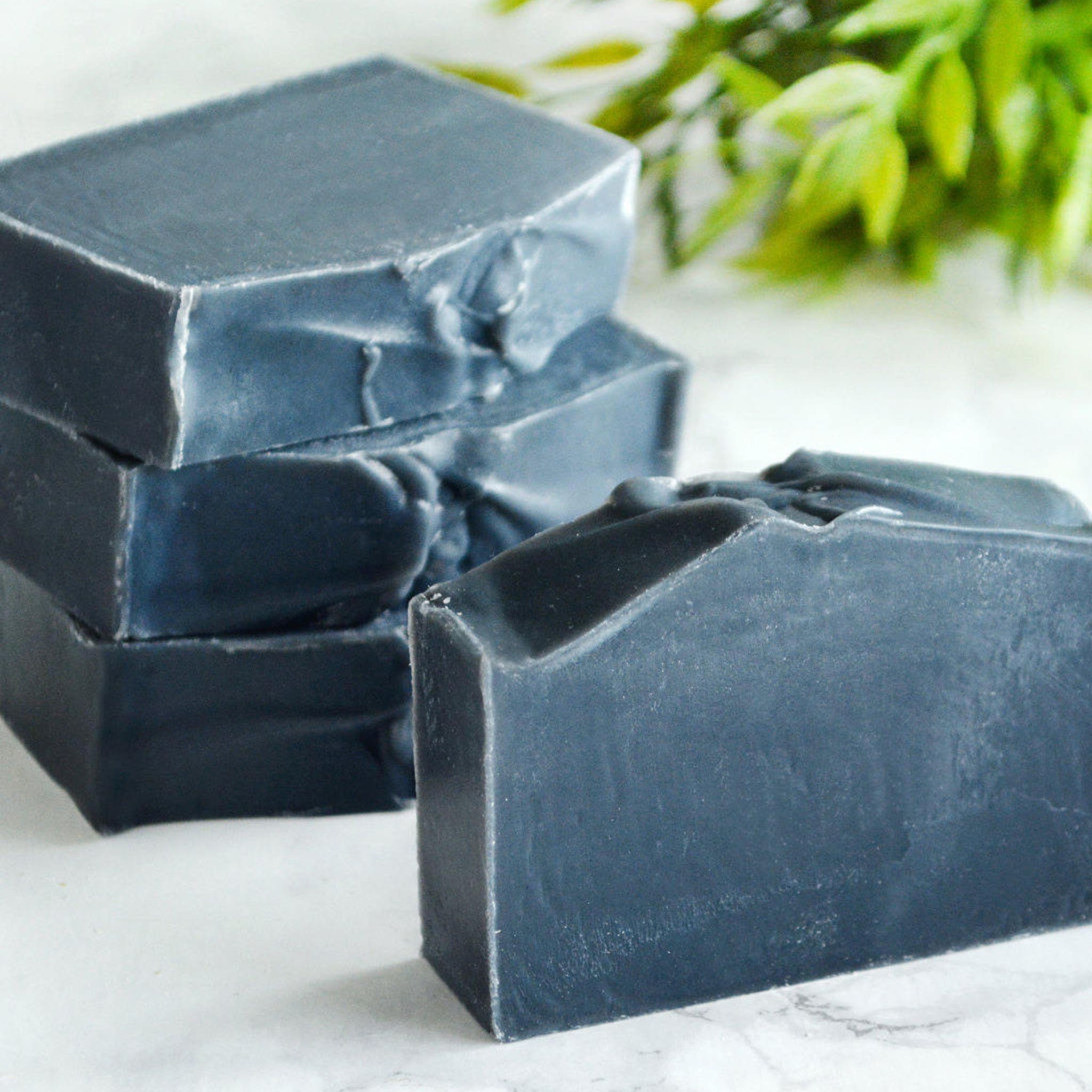 Charcoal facial soap bars, dark gray rectangular, stacked with rough edges