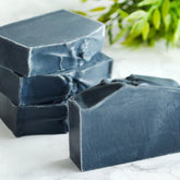 Charcoal facial soap bars, dark gray rectangular, stacked with rough edges