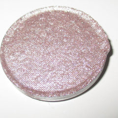 Close-up of shimmery Bubbly Eye Shadow in a compact with reflective champagne-toned powder and sleek black case