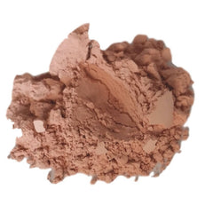 Powder makeup in light brown color with a textured, crumbly appearance