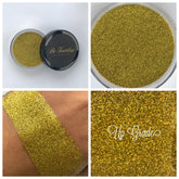 Loose glitter eye shadow, gold, sparkly texture, Up Grade brand visible