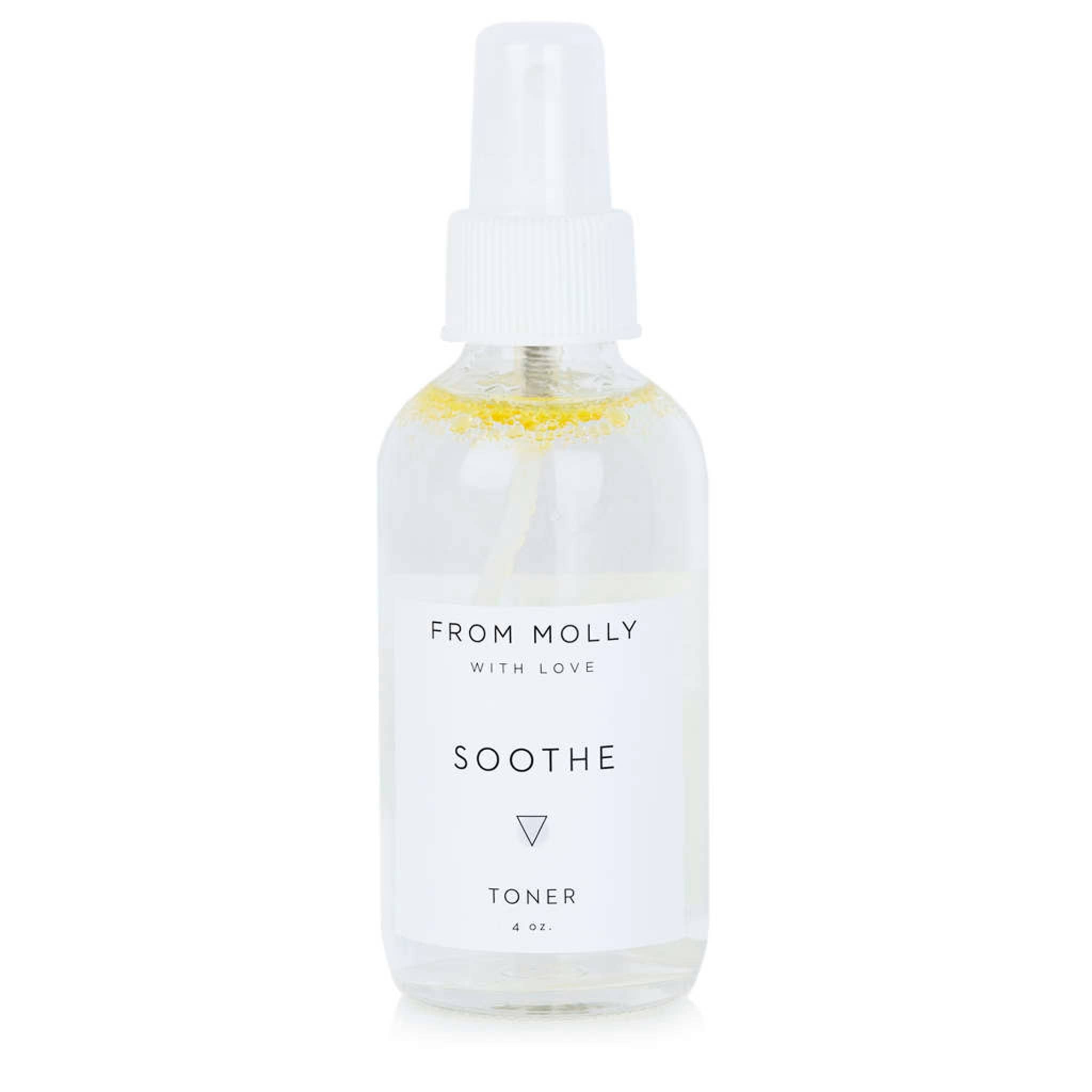 Toner spray bottle, clear glass with white label, "From Molly With Love" visible