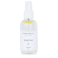 Toner spray bottle, clear glass with white label, "From Molly With Love" visible