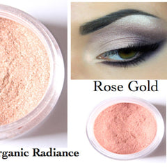 Rose gold eyeshadow powder in clear container, Organic Radiance brand, shown on eye