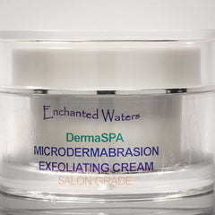 Microdermabrasion cream in clear and white jar with silver trim, Enchanted Waters brand visible