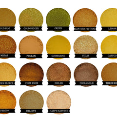 Side view of sparkling gold eye shadow pot showing reflective metallic finish and compact size