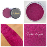 Glitter eyeshadow, pink glitter, Barbie Goals text, cosmetic application