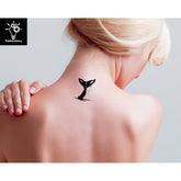 Colorful whale-shaped temporary tattoos for kids, safe and skin-friendly, arranged on a clean white surface