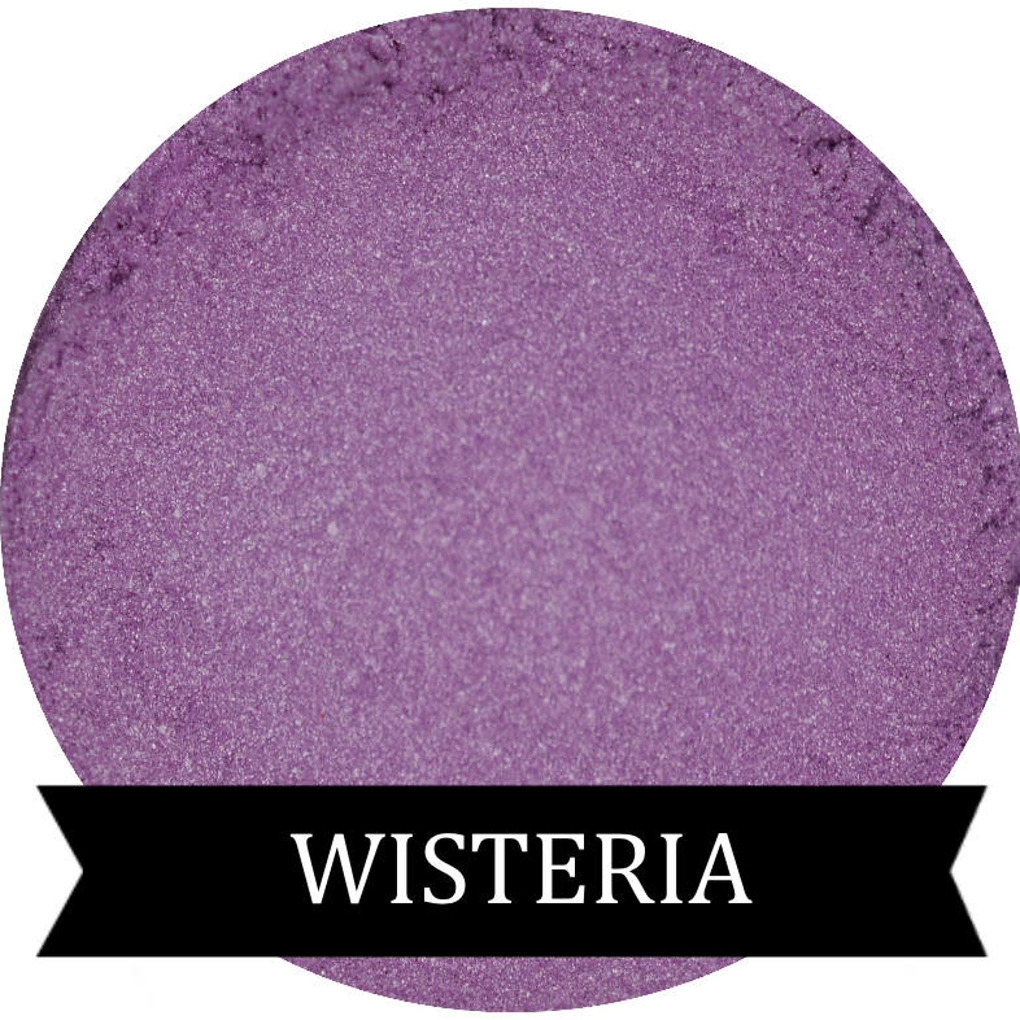 Close-up of wisteria pastel purple pressed powder eyeshadow in compact case with soft matte finish