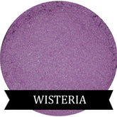 Close-up of wisteria pastel purple pressed powder eyeshadow in compact case with soft matte finish