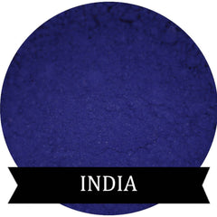 Matte eyeshadow powder in indigo color, circular shape with "INDIA" text on black banner