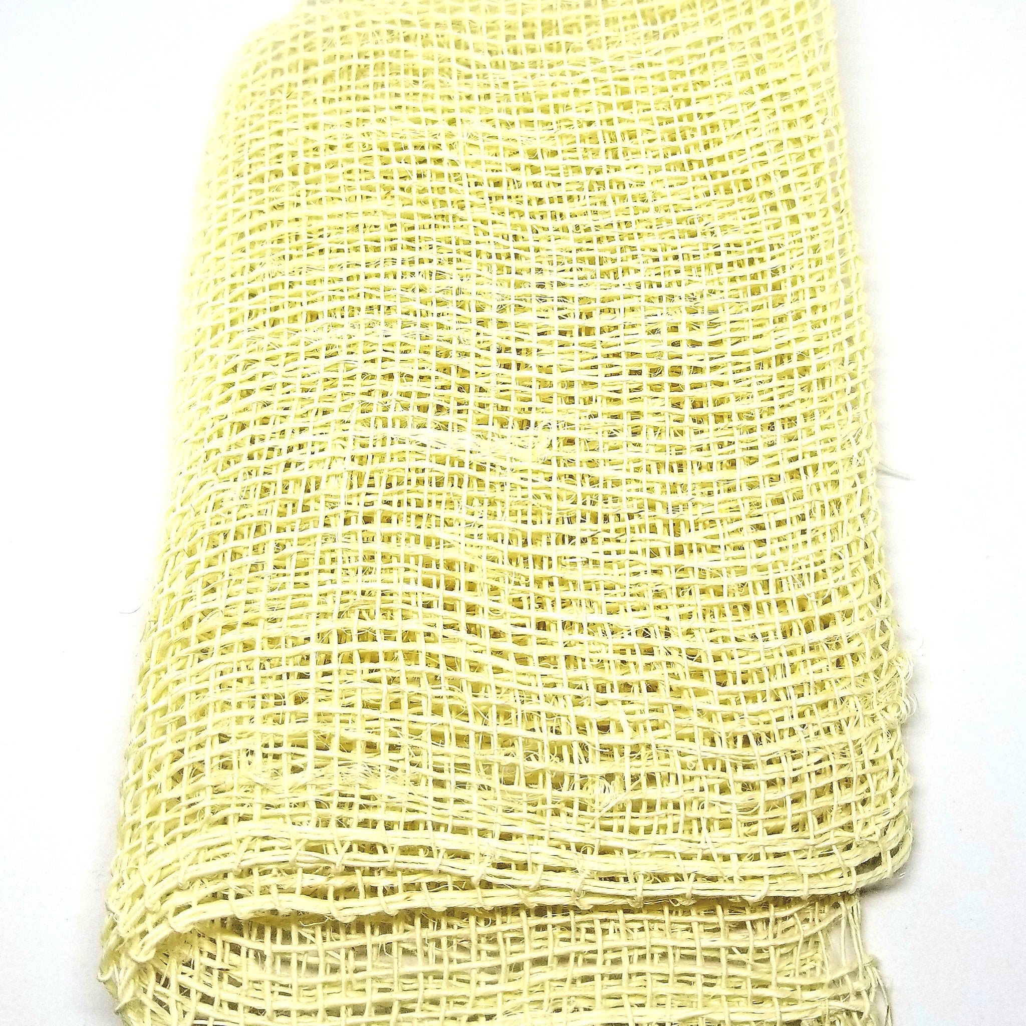 Natural agave cactus fiber exfoliating washcloth with textured weave on bamboo hook, beige tones, eco-luxury skincare accessory