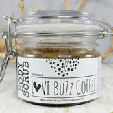 Body scrub in glass jar with metal clasp and "Love Buzz Coffee" label