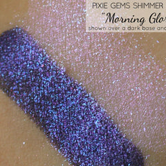 Pixie Gems shimmer swatch, blue and purple glitter, Morning Glow over skin