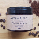 Coffee scrub jar with black lid, brown label, and MookaiteAU brand name displayed