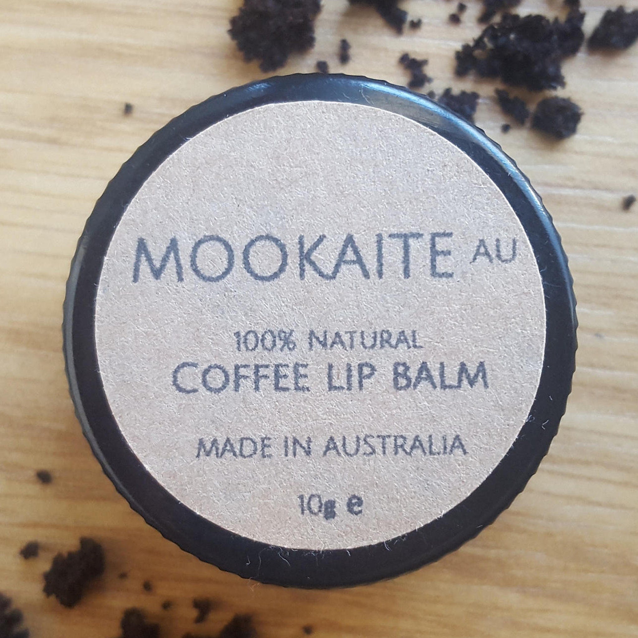Coffee lip balm with black rim and tan label, MookaiteAU brand visible