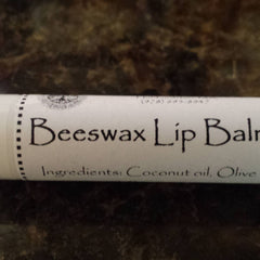 Beeswax Lip Balm tube with white label, black text, and dotted border