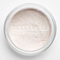 Close-up of soft vanilla mineral eyeshadow with smooth, powdery texture in a compact case