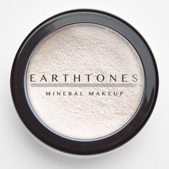 Side view of vanilla mineral eyeshadow compact showing soft matte texture and neutral beige tone