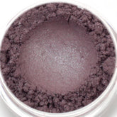 Eyeshadow mineral makeup in silver gray blue, with a textured powder and a smooth center, in a clear jar