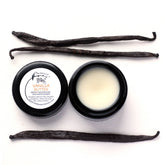 White jar of organic vanilla butter moisturizer with gold lid and minimalist label, showcasing silky texture