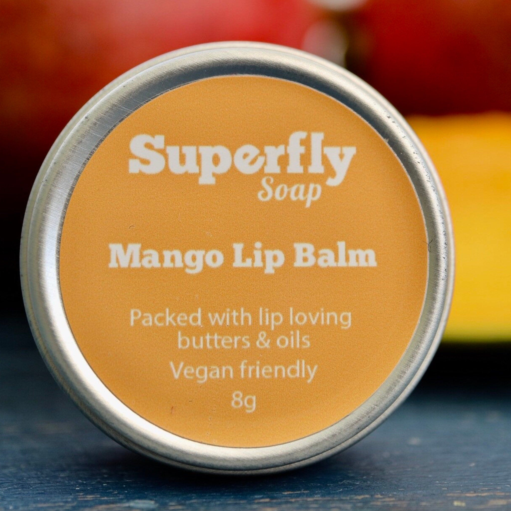 Mango lip balm, orange label with Superfly Soap text, silver metal tin container