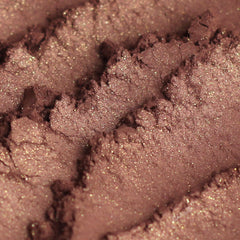 Close-up of burgundy plum and copper shimmer vegan mineral eyeshadow with metallic finish