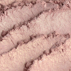 Eyeshadow powder in light pink with gold shimmer, Heiress brand visible