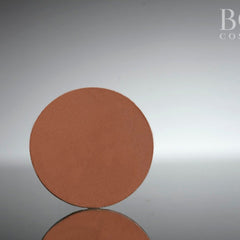 Pressed eyeshadow pan, brown matte finish, circular shape, Kadijah Cosmetics product