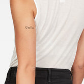 Temporary tattoos, black geometric symbols on arm, skin tone visible