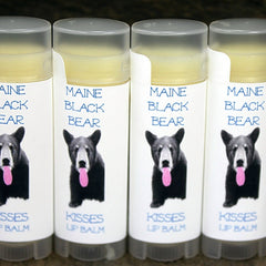 Lip balms with white labels, Maine Black Bear Kisses brand, clear tubes and gray caps