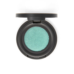 Vibrant mermaid green eyeshadow pan with shimmer finish in sleek black compact packaging