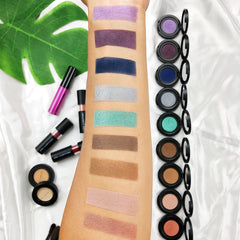 Close-up of vibrant mermaid green eyeshadow with shimmering metallic finish in compact palette