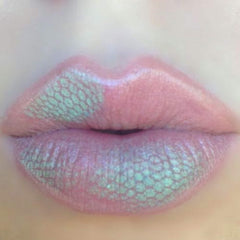 Lip makeup with pink and teal iridescent pattern on lips