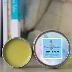 Lip balm in metal tin with yellow balm, and Miss Kinslee's Cotton Candy label