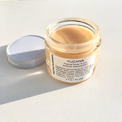 Cleansing balm in glass jar, light orange color, with white label, by INGYIN FLOWERS
