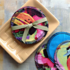 Reusable facial rounds, colorful floral print fabric, blue backing, Rocky Mountain Herbs brand
