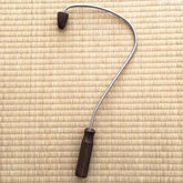 Acupressure back massage tool, silver metal and dark wood handle, curved design