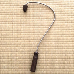 Acupressure back massage tool, silver metal and dark wood handle, curved design