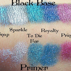 Eye shadow swatches with silver, blue, and pink glitter, on skin, with "Black Base" text above
