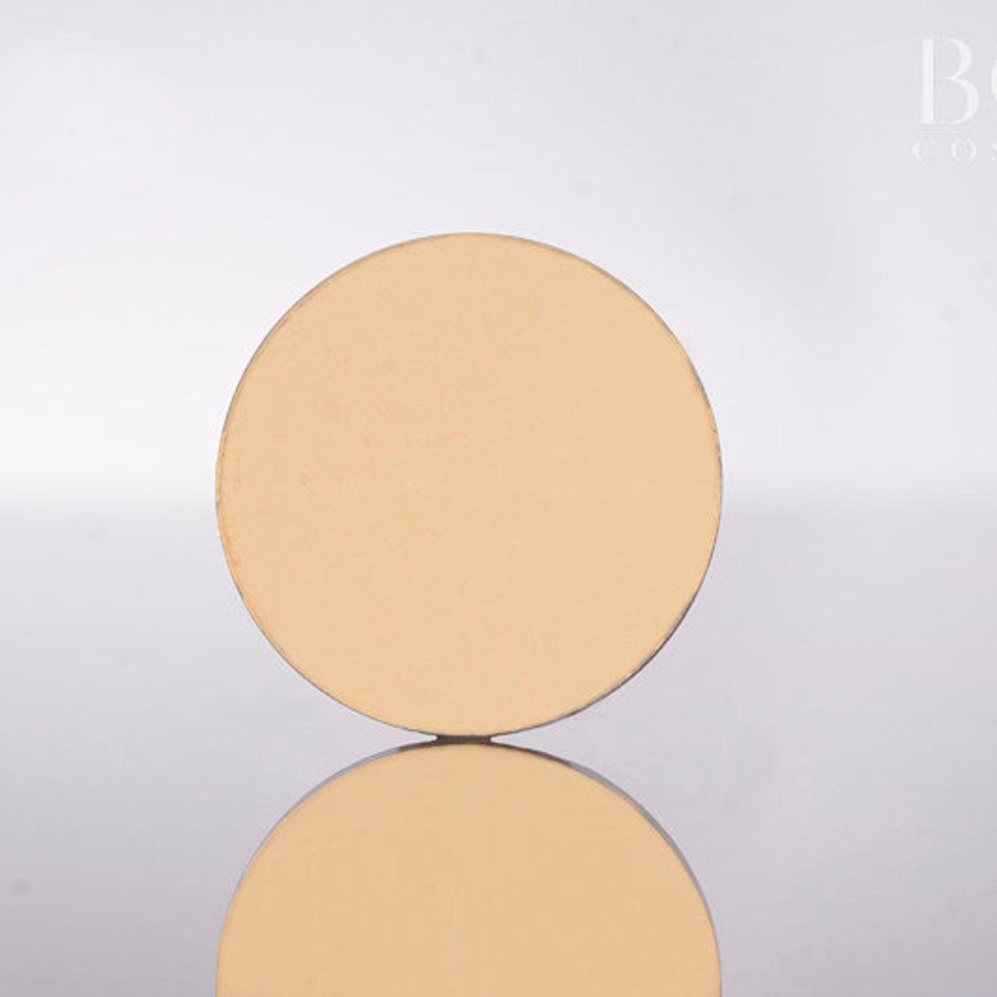 Single pressed matte eyeshadow pan in vibrant Greek Isles yellow with smooth texture and round 37mm compact