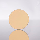Single pressed matte eyeshadow pan in vibrant Greek Isles yellow with smooth texture and round 37mm compact