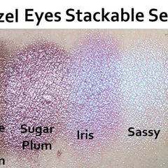 Side view of 7 stackable eyeshadow pans in warm hazel shades with mirrored compact case